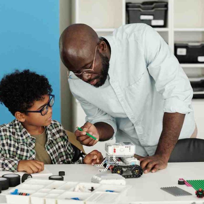 young-african-american-teacher-of-robotics-pointin-2025-03-14-01-56-47-utc (1)