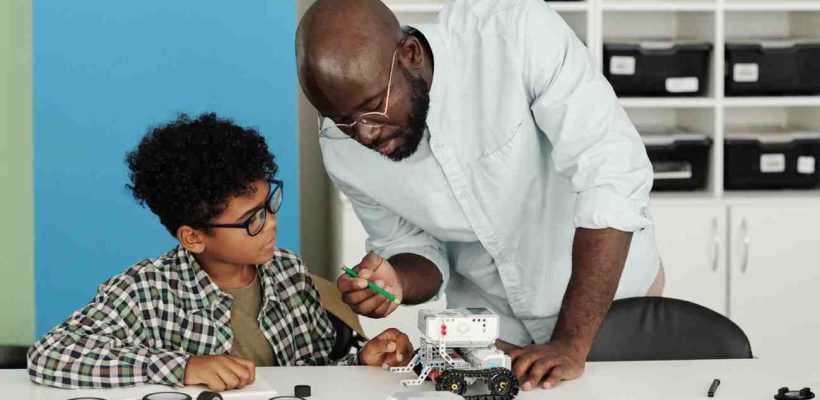 young-african-american-teacher-of-robotics-pointin-2025-03-14-01-56-47-utc (1)
