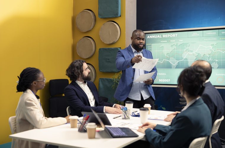 Corporate employees reviewing transactional info to improve customer satisfaction, expanding on the market. General director and his team making critical decisions regarding activity development.